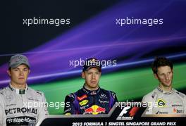 Nico Rosberg (GER), Mercedes GP, Sebastian Vettel (GER), Red Bull Racing and Romain Grosjean (FRA), Lotus F1 Team  21.09.2013. Formula 1 World Championship, Rd 13, Singapore Grand Prix, Singapore, Singapore, Qualifying Day.