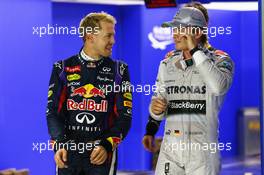 Sebastian Vettel (GER) Red Bull Racing RB9 and Nico Rosberg (GER) Mercedes AMG F1 W04. 21.09.2013. Formula 1 World Championship, Rd 13, Singapore Grand Prix, Singapore, Singapore, Qualifying Day.