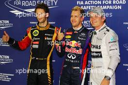 Qualifying top three in parc ferme (L to R): Romain Grosjean (FRA) Lotus F1 Team, third; Sebastian Vettel (GER) Red Bull Racing, pole position; Nico Rosberg (GER) Mercedes AMG F1, second. 21.09.2013. Formula 1 World Championship, Rd 13, Singapore Grand Prix, Singapore, Singapore, Qualifying Day.