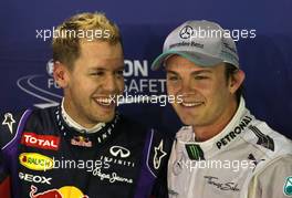 Sebastian Vettel (GER), Red Bull Racing and Nico Rosberg (GER), Mercedes GP  21.09.2013. Formula 1 World Championship, Rd 13, Singapore Grand Prix, Singapore, Singapore, Qualifying Day.