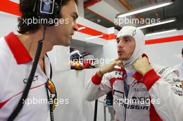 (L to R): Marc Hynes (GBR) Marussia F1 Team Driver Coach with Jules Bianchi (FRA) Marussia F1 Team. 21.09.2013. Formula 1 World Championship, Rd 13, Singapore Grand Prix, Singapore, Singapore, Qualifying Day.