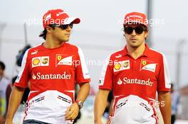 (L to R): Felipe Massa (BRA) Ferrari and Fernando Alonso (ESP) Ferrari on the drivers parade. 22.09.2013. Formula 1 World Championship, Rd 13, Singapore Grand Prix, Singapore, Singapore, Race Day.