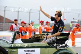 Sebastian Vettel (GER) Red Bull Racing on the drivers parade. 22.09.2013. Formula 1 World Championship, Rd 13, Singapore Grand Prix, Singapore, Singapore, Race Day.