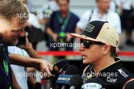 Kimi Raikkonen (FIN) Lotus F1 Team with the media. 19.09.2013. Formula 1 World Championship, Rd 13, Singapore Grand Prix, Singapore, Singapore, Preparation Day.