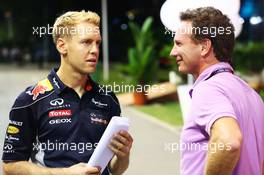 (L to R): Sebastian Vettel (GER) Red Bull Racing with Christian Horner (GBR) Red Bull Racing Team Principal. 19.09.2013. Formula 1 World Championship, Rd 13, Singapore Grand Prix, Singapore, Singapore, Preparation Day.