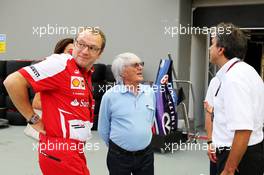 (L to R): Stefano Domenicali (ITA) Ferrari General Director with Bernie Ecclestone (GBR) CEO Formula One Group (FOM) and Pasquale Lattuneddu (ITA) of the FOM. 19.09.2013. Formula 1 World Championship, Rd 13, Singapore Grand Prix, Singapore, Singapore, Preparation Day.