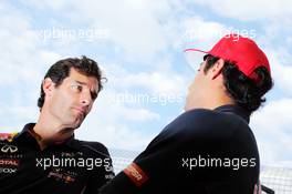 (L to R): Mark Webber (AUS) Red Bull Racing with Daniel Ricciardo (AUS) Scuderia Toro Rosso. 19.09.2013. Formula 1 World Championship, Rd 13, Singapore Grand Prix, Singapore, Singapore, Preparation Day.