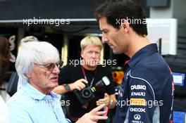 (L to R): Bernie Ecclestone (GBR) CEO Formula One Group (FOM) with Mark Webber (AUS) Red Bull Racing. 19.09.2013. Formula 1 World Championship, Rd 13, Singapore Grand Prix, Singapore, Singapore, Preparation Day.