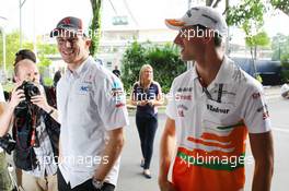 (L to R): Nico Hulkenberg (GER) Sauber with Adrian Sutil (GER) Sahara Force India F1. 19.09.2013. Formula 1 World Championship, Rd 13, Singapore Grand Prix, Singapore, Singapore, Preparation Day.