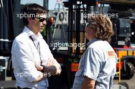 Toto Wolff (GER) Mercedes AMG F1 Shareholder and Executive Director (Left) with a Pirelli employee. 19.07.2013. Formula One Young Drivers Test, Day 3, Silverstone, England.