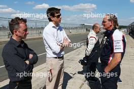 (L to R): Paddy Lowe (GBR) Mercedes AMG F1 Executive Director (Technical) with Toto Wolff (GER) Mercedes AMG F1 Shareholder and Executive Director and Dickie Standford (GBR) Williams Team Manager. 19.07.2013. Formula One Young Drivers Test, Day 3, Silverstone, England.