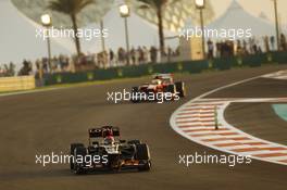 Kimi Raikkonen (FIN) Lotus F1 E21 leads Felipe Massa (BRA) Ferrari F138. 01.11.2013. Formula 1 World Championship, Rd 17, Abu Dhabi Grand Prix, Yas Marina Circuit, Abu Dhabi, Practice Day.