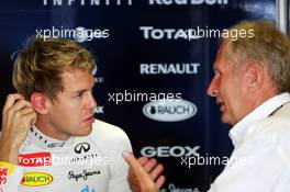 (L to R): Sebastian Vettel (GER) Red Bull Racing with Dr Helmut Marko (AUT) Red Bull Motorsport Consultant. 01.11.2013. Formula 1 World Championship, Rd 17, Abu Dhabi Grand Prix, Yas Marina Circuit, Abu Dhabi, Practice Day.