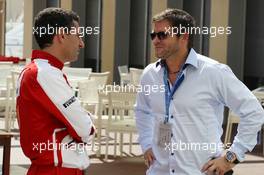 (L to R): Andrea Stella (ITA) Ferrari Race Engineer with Dave Robertson (GBR) Driver Manager of Kimi Raikkonen (FIN) Lotus F1 Team. 01.11.2013. Formula 1 World Championship, Rd 17, Abu Dhabi Grand Prix, Yas Marina Circuit, Abu Dhabi, Practice Day.