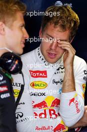 Sebastian Vettel (GER) Red Bull Racing with Heikki Huovinen (FIN) Personal Trainer. 01.11.2013. Formula 1 World Championship, Rd 17, Abu Dhabi Grand Prix, Yas Marina Circuit, Abu Dhabi, Practice Day.