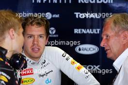 Sebastian Vettel (GER) Red Bull Racing with Heikki Huovinen (FIN) Personal Trainer (Left) and Dr Helmut Marko (AUT) Red Bull Motorsport Consultant (Right). 01.11.2013. Formula 1 World Championship, Rd 17, Abu Dhabi Grand Prix, Yas Marina Circuit, Abu Dhabi, Practice Day.