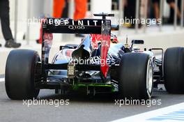 Sebastian Vettel (GER) Red Bull Racing RB9 running flow-vis paint on the rear diffuser. 01.11.2013. Formula 1 World Championship, Rd 17, Abu Dhabi Grand Prix, Yas Marina Circuit, Abu Dhabi, Practice Day.