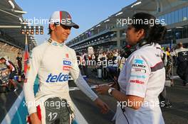 (L to R): Esteban Gutierrez (MEX) Sauber wi Monisha Kaltenborn (AUT) Sauber Team Principal on the grid. 03.11.2013. Formula 1 World Championship, Rd 17, Abu Dhabi Grand Prix, Yas Marina Circuit, Abu Dhabi, Race Day.