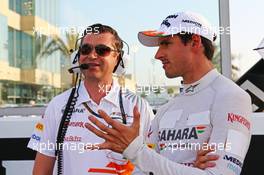 Adrian Sutil (GER) Sahara Force India F1 with Bradley Joyce (GBR) Sahara Force India F1 Race Engineer on the grid. 03.11.2013. Formula 1 World Championship, Rd 17, Abu Dhabi Grand Prix, Yas Marina Circuit, Abu Dhabi, Race Day.