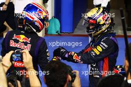Race winner Sebastian Vettel (GER) Red Bull Racing celebrates in parc ferme with Mark Webber (AUS) Red Bull Racing (Left). 03.11.2013. Formula 1 World Championship, Rd 17, Abu Dhabi Grand Prix, Yas Marina Circuit, Abu Dhabi, Race Day.