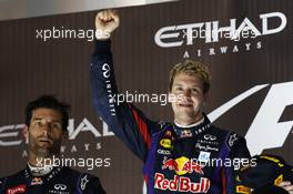 Race winner Sebastian Vettel (GER) Red Bull Racing celebrates on the podium. 03.11.2013. Formula 1 World Championship, Rd 17, Abu Dhabi Grand Prix, Yas Marina Circuit, Abu Dhabi, Race Day.