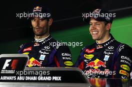 (L to R): Mark Webber (AUS) Red Bull Racing and race winner Sebastian Vettel (GER) Red Bull Racing in the FIA Press Conference. 03.11.2013. Formula 1 World Championship, Rd 17, Abu Dhabi Grand Prix, Yas Marina Circuit, Abu Dhabi, Race Day.
