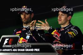 (L to R): Mark Webber (AUS) Red Bull Racing and race winner Sebastian Vettel (GER) Red Bull Racing in the FIA Press Conference. 03.11.2013. Formula 1 World Championship, Rd 17, Abu Dhabi Grand Prix, Yas Marina Circuit, Abu Dhabi, Race Day.