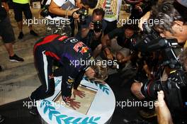 Race winner Sebastian Vettel (GER) Red Bull Racing celebrates after the race. 03.11.2013. Formula 1 World Championship, Rd 17, Abu Dhabi Grand Prix, Yas Marina Circuit, Abu Dhabi, Race Day.