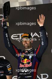 Mark Webber (AUS) Red Bull Racing celebrates his second position on the podium. 03.11.2013. Formula 1 World Championship, Rd 17, Abu Dhabi Grand Prix, Yas Marina Circuit, Abu Dhabi, Race Day.