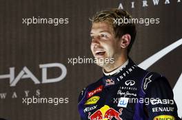Race winner Sebastian Vettel (GER) Red Bull Racing celebrates on the podium. 03.11.2013. Formula 1 World Championship, Rd 17, Abu Dhabi Grand Prix, Yas Marina Circuit, Abu Dhabi, Race Day.