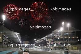 Charles Pic (FRA) Caterham CT03 finishes as fireworks fly over the circuit. 03.11.2013. Formula 1 World Championship, Rd 17, Abu Dhabi Grand Prix, Yas Marina Circuit, Abu Dhabi, Race Day.