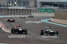 Jean-Eric Vergne (FRA), Scuderia Toro Rosso  and Nico Rosberg (GER), Mercedes GP  03.11.2013. Formula 1 World Championship, Rd 17, Abu Dhabi Grand Prix, Yas Marina Circuit, Abu Dhabi, Race Day.