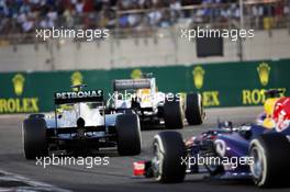 Paul di Resta (GBR) Sahara Force India VJM06 leads Nico Rosberg (GER) Mercedes AMG F1 W04 and Mark Webber (AUS) Red Bull Racing RB9. 03.11.2013. Formula 1 World Championship, Rd 17, Abu Dhabi Grand Prix, Yas Marina Circuit, Abu Dhabi, Race Day.