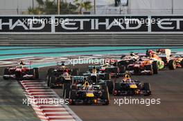 Sebastian Vettel (GER) Red Bull Racing RB9 leads at the start of the race. 03.11.2013. Formula 1 World Championship, Rd 17, Abu Dhabi Grand Prix, Yas Marina Circuit, Abu Dhabi, Race Day.