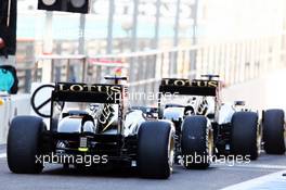 Kimi Raikkonen (FIN) Lotus F1 E21 and Romain Grosjean (FRA) Lotus F1 E21 leave the pits. 02.11.2013. Formula 1 World Championship, Rd 17, Abu Dhabi Grand Prix, Yas Marina Circuit, Abu Dhabi, Qualifying Day.