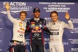 Qualifying top three in parc ferme (L to R): Sebastian Vettel (GER) Red Bull Racing, second; Mark Webber (AUS) Red Bull Racing, pole position; Nico Rosberg (GER) Mercedes AMG F1, third. 02.11.2013. Formula 1 World Championship, Rd 17, Abu Dhabi Grand Prix, Yas Marina Circuit, Abu Dhabi, Qualifying Day.