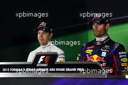 (L to R): Sebastian Vettel (GER) Red Bull Racing and pole sitter Mark Webber (AUS) Red Bull Racing in the FIA Press Conference. 02.11.2013. Formula 1 World Championship, Rd 17, Abu Dhabi Grand Prix, Yas Marina Circuit, Abu Dhabi, Qualifying Day.
