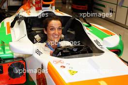 Lizzie Armitstead (GBR) Professional Cyclist sits in the Sahara Force India F1 VJM06. 02.11.2013. Formula 1 World Championship, Rd 17, Abu Dhabi Grand Prix, Yas Marina Circuit, Abu Dhabi, Qualifying Day.