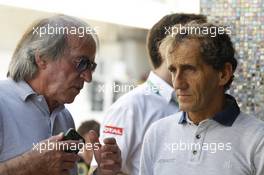 (L to R): Jacques Laffite (FRA) with Alain Prost (FRA). 02.11.2013. Formula 1 World Championship, Rd 17, Abu Dhabi Grand Prix, Yas Marina Circuit, Abu Dhabi, Qualifying Day.