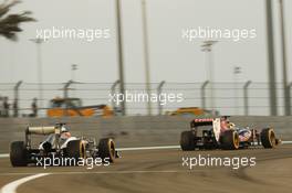Jean-Eric Vergne (FRA) Scuderia Toro Rosso STR8 leads Nico Hulkenberg (GER) Sauber C32. 02.11.2013. Formula 1 World Championship, Rd 17, Abu Dhabi Grand Prix, Yas Marina Circuit, Abu Dhabi, Qualifying Day.