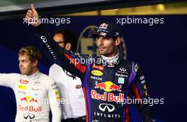 Mark Webber (AUS) Red Bull Racing celebrates his pole position in parc ferme with team mate Sebastian Vettel (GER) Red Bull Racing. 02.11.2013. Formula 1 World Championship, Rd 17, Abu Dhabi Grand Prix, Yas Marina Circuit, Abu Dhabi, Qualifying Day.