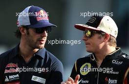 Kimi Raikkonen (FIN), Lotus F1 Team and Jean-Eric Vergne (FRA), Scuderia Toro Rosso   03.11.2013. Formula 1 World Championship, Rd 17, Abu Dhabi Grand Prix, Yas Marina Circuit, Abu Dhabi, Race Day.