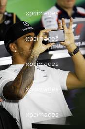 Lewis Hamilton (GBR) Mercedes AMG F1 in the FIA Press Conference. 31.10.2013. Formula 1 World Championship, Rd 17, Abu Dhabi Grand Prix, Yas Marina Circuit, Abu Dhabi, Preparation Day.