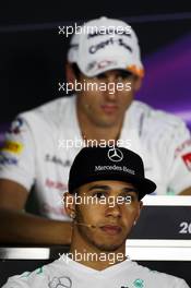 Lewis Hamilton (GBR) Mercedes AMG F1 and Adrian Sutil (GER) Sahara Force India F1 in the FIA Press Conference. 31.10.2013. Formula 1 World Championship, Rd 17, Abu Dhabi Grand Prix, Yas Marina Circuit, Abu Dhabi, Preparation Day.