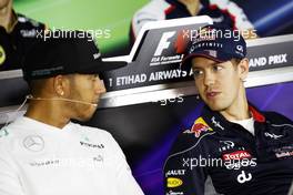 (L to R): Lewis Hamilton (GBR) Mercedes AMG F1 and Sebastian Vettel (GER) Red Bull Racing in the FIA Press Conference. 31.10.2013. Formula 1 World Championship, Rd 17, Abu Dhabi Grand Prix, Yas Marina Circuit, Abu Dhabi, Preparation Day.