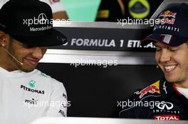 (L to R): Lewis Hamilton (GBR) Mercedes AMG F1 and Sebastian Vettel (GER) Red Bull Racing in the FIA Press Conference. 31.10.2013. Formula 1 World Championship, Rd 17, Abu Dhabi Grand Prix, Yas Marina Circuit, Abu Dhabi, Preparation Day.