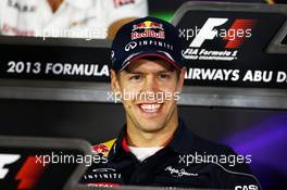 Sebastian Vettel (GER) Red Bull Racing in the FIA Press Conference. 31.10.2013. Formula 1 World Championship, Rd 17, Abu Dhabi Grand Prix, Yas Marina Circuit, Abu Dhabi, Preparation Day.
