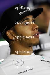 Lewis Hamilton (GBR) Mercedes AMG F1 in the FIA Press Conference. 31.10.2013. Formula 1 World Championship, Rd 17, Abu Dhabi Grand Prix, Yas Marina Circuit, Abu Dhabi, Preparation Day.