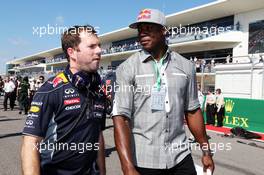 DeMarcus Ware (USA) Dallas Cowboys American Footballer with Dominik Mitsch (AUT) Red Bull Racing Marketing. 17.11.2013. Formula 1 World Championship, Rd 18, United States Grand Prix, Austin, Texas, USA, Race Day.