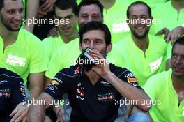 Mark Webber (AUS) Red Bull Racing with a bottle of Jagermeister at the team celebration. 17.11.2013. Formula 1 World Championship, Rd 18, United States Grand Prix, Austin, Texas, USA, Race Day.